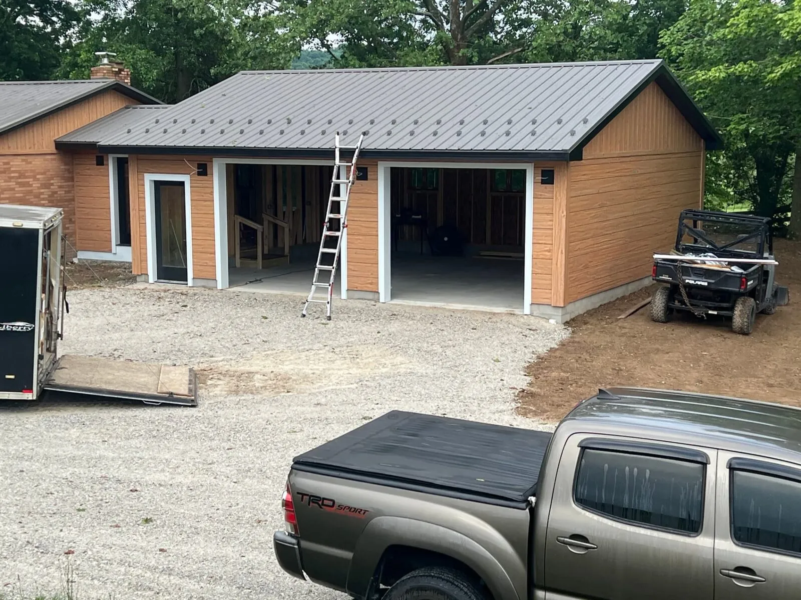 Garage build with metal roof and wood siding
